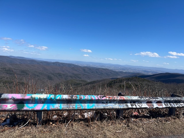 The colors of the fez hat depicted on Redish Know in West Virginia on the guard rail